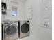 Laundry room with washer and dryer hookups and laundry signage at 1335 Berry Ln, Davenport, FL 33837