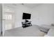 Spacious living room with modern furniture, neutral carpet, and easy access to other rooms at 1335 Berry Ln, Davenport, FL 33837