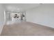 Open living space seamlessly connects the living room to a well-equipped kitchen with bar seating at 1335 Berry Ln, Davenport, FL 33837