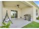 The covered patio features a ceiling fan and grill perfect for outdoor entertaining at 1335 Berry Ln, Davenport, FL 33837