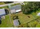 Aerial view of the home showing the fenced backyard with shed and mature landscaping at 2825 Woodcrest Ln, Lakeland, FL 33805