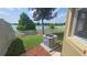 Private backyard oasis featuring a meticulously landscaped yard and serene lake views at 2528 Ladoga Dr, Lakeland, FL 33805