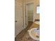 Bathroom area showcasing double sinks and granite countertop with door to walk in closet at 2528 Ladoga Dr, Lakeland, FL 33805