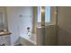 Bright bathroom featuring a separate tub and enclosed shower, providing a spa-like experience at home at 2528 Ladoga Dr, Lakeland, FL 33805