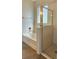 Inviting bathroom featuring a separate tub and enclosed shower, ideal for a relaxing and refreshing experience at 2528 Ladoga Dr, Lakeland, FL 33805