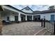 Clubhouse patio with stone columns, tables and chairs offers a place to relax and enjoy the outdoors at 2528 Ladoga Dr, Lakeland, FL 33805