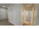 Hallway features tile floors, neutral walls, and access to various rooms at 2528 Ladoga Dr, Lakeland, FL 33805