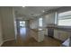 Open kitchen with granite counters, stainless appliances, and views of the water at 2528 Ladoga Dr, Lakeland, FL 33805