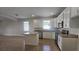 Bright kitchen featuring white cabinets, granite counters, and stainless steel appliances at 2528 Ladoga Dr, Lakeland, FL 33805