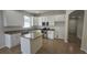 Modern kitchen with stainless steel appliances, granite countertops, and a center island, perfect for meal preparation at 2528 Ladoga Dr, Lakeland, FL 33805