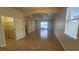 Living room featuring neutral walls, tile flooring, and access to a view at 2528 Ladoga Dr, Lakeland, FL 33805