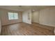 Living room with wood flooring, neutral walls, and an open layout at 2528 Ladoga Dr, Lakeland, FL 33805