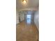 Spacious living room with tile flooring and sliding glass door leading to outdoor area at 2528 Ladoga Dr, Lakeland, FL 33805