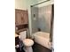 Nicely appointed bathroom with tiled shower/tub combo and integrated storage at 3435 Swindell Rd, Lakeland, FL 33810