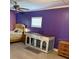 Bright bedroom with laminate flooring, fan, and custom built-in furniture at 3435 Swindell Rd, Lakeland, FL 33810