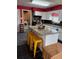 Bright kitchen featuring an island with granite countertops and stylish yellow stools at 3435 Swindell Rd, Lakeland, FL 33810