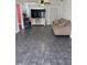 Inviting living room with neutral décor, tiled flooring, and plenty of natural light at 3435 Swindell Rd, Lakeland, FL 33810