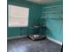 Cozy room featuring tile flooring, a bright window, and convenient built-in shelving for storage at 3435 Swindell Rd, Lakeland, FL 33810