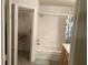 Bright and efficient bathroom with tub/shower combo and a closet with organizers at 9053 Lee Vista Blvd # 1405, Orlando, FL 32829