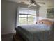 Inviting bedroom with a large window, soft natural lighting, and stylish accents at 9053 Lee Vista Blvd # 1405, Orlando, FL 32829