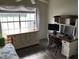 Bright bedroom with a computer desk, dresser, bed, and views of the water at 9053 Lee Vista Blvd # 1405, Orlando, FL 32829