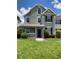 Charming two-story home with a covered front porch, fresh landscaping, and a well-maintained lawn at 9053 Lee Vista Blvd # 1405, Orlando, FL 32829