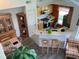 Open-concept kitchen featuring modern appliances, a breakfast bar, and seamless connection to the living space at 9053 Lee Vista Blvd # 1405, Orlando, FL 32829