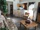 Cozy living room featuring comfortable seating, an open layout, and views into the adjacent kitchen at 9053 Lee Vista Blvd # 1405, Orlando, FL 32829