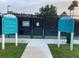 Community pickleball courts with clear signage and rules for recreational activities and resident enjoyment at 9053 Lee Vista Blvd # 1405, Orlando, FL 32829
