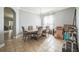 Bright dining room features a chandelier, tile flooring, and a wooden table with upholstered chairs at 4931 Jetton Dr, Orlando, FL 32837