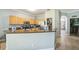 Spacious kitchen with wood cabinets, black countertops, and stainless steel appliances at 4931 Jetton Dr, Orlando, FL 32837