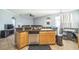 Kitchen showcases a breakfast bar, stainless steel dishwasher, and an open layout into the living area at 4931 Jetton Dr, Orlando, FL 32837