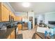 The kitchen is equipped with stainless steel appliances, wood cabinets, and a functional layout at 4931 Jetton Dr, Orlando, FL 32837