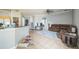 Inviting living room with tile floors, a plush rug, and comfortable leather seating at 4931 Jetton Dr, Orlando, FL 32837