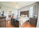 The main bedroom features hardwood floors, two windows, and a door leading to the bathroom at 4931 Jetton Dr, Orlando, FL 32837