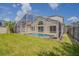 Expansive backyard with a private pool area enclosed by a screened lanai, ideal for outdoor enjoyment at 4444 Withrowwood Ct, Orlando, FL 32837