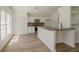 Bright kitchen featuring stainless steel appliances, granite countertops, and sleek white cabinetry at 4444 Withrowwood Ct, Orlando, FL 32837