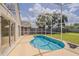 Private screened-in pool surrounded by lush greenery and a spacious patio, perfect for relaxation and outdoor entertainment at 4444 Withrowwood Ct, Orlando, FL 32837