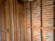 Exposed pipes and brick wall in a gutted bathroom, ready for renovation at 1629 Lindsey Ter, Deltona, FL 32725