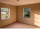 Bright bedroom with ample natural light from two windows at 1629 Lindsey Ter, Deltona, FL 32725