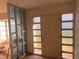 The foyer area has decorative window accents that bring a unique charm to this home at 1629 Lindsey Ter, Deltona, FL 32725
