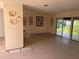 Spacious living room featuring sliding glass doors, ready for personalized updates and offering bright, natural light at 1629 Lindsey Ter, Deltona, FL 32725