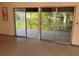 The sliding glass doors lead to a screened-in patio overlooking the backyard at 1629 Lindsey Ter, Deltona, FL 32725