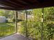 A screened in porch is shown with trees in the background at 1629 Lindsey Ter, Deltona, FL 32725