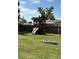 Backyard playground with slide and swing at 3453 Duff Rd, Lakeland, FL 33810