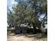 View of backyard shed under large tree at 3453 Duff Rd, Lakeland, FL 33810