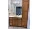 Bathroom featuring wooden cabinets with an extended tower cabinet at 3453 Duff Rd, Lakeland, FL 33810