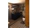 Functional laundry room featuring washer and dryer hookups with storage shelves and tiled floors at 3453 Duff Rd, Lakeland, FL 33810