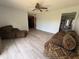 Spacious living area with cozy seating and vinyl floors, ideal for entertaining and relaxing at 3453 Duff Rd, Lakeland, FL 33810