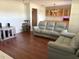 Cozy living room featuring hardwood floors and comfortable seating, perfect for relaxation at 3453 Duff Rd, Lakeland, FL 33810